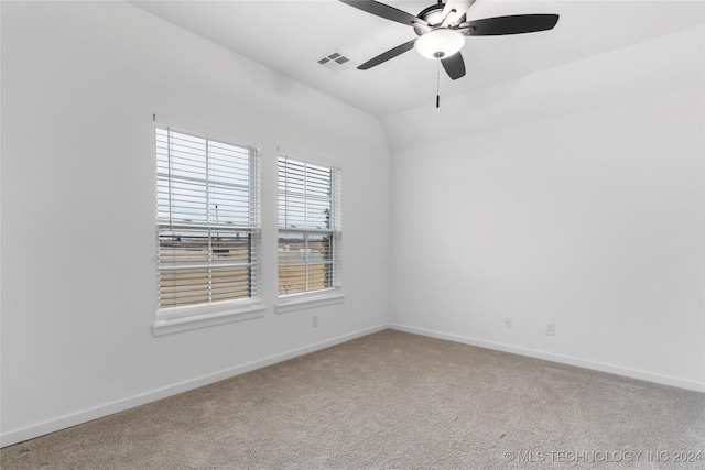 carpeted empty room featuring ceiling fan