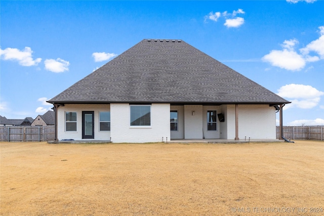 rear view of property featuring a patio