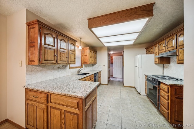 kitchen with backsplash, black appliances, sink, hanging light fixtures, and light stone counters