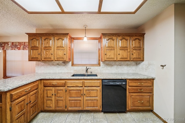 kitchen featuring dishwasher, pendant lighting, backsplash, and sink