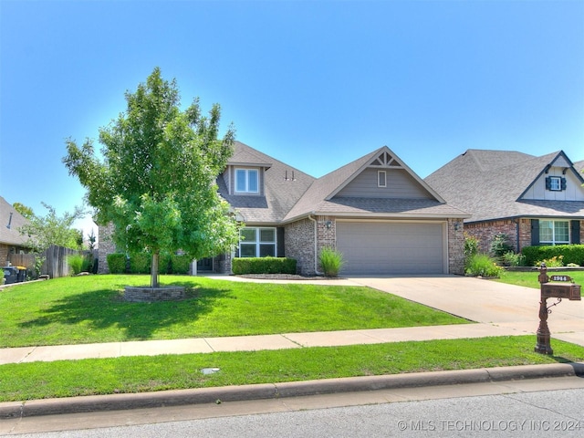 view of front of home featuring a garage and a front lawn