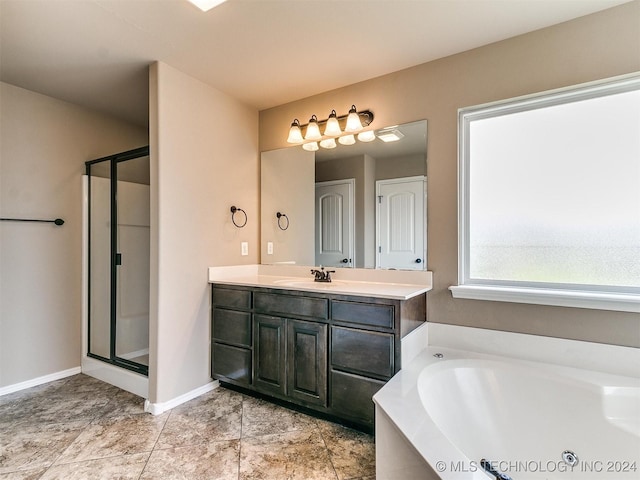 bathroom featuring vanity and separate shower and tub