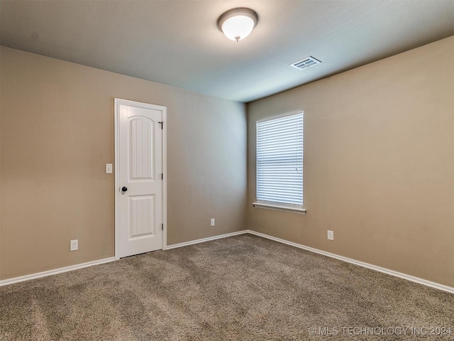 empty room with carpet flooring