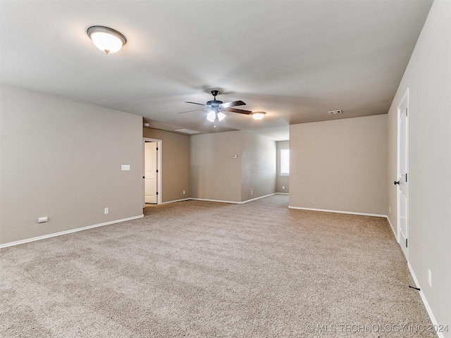 carpeted empty room with ceiling fan