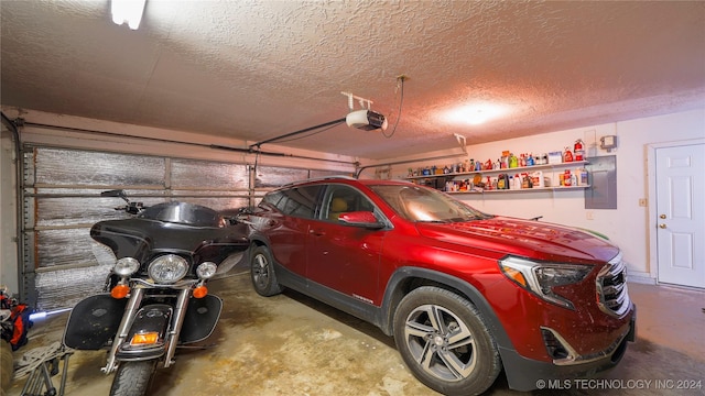 garage with electric panel and a garage door opener