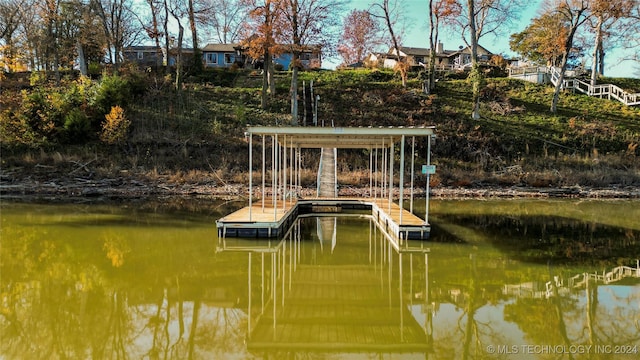 view of dock with a water view