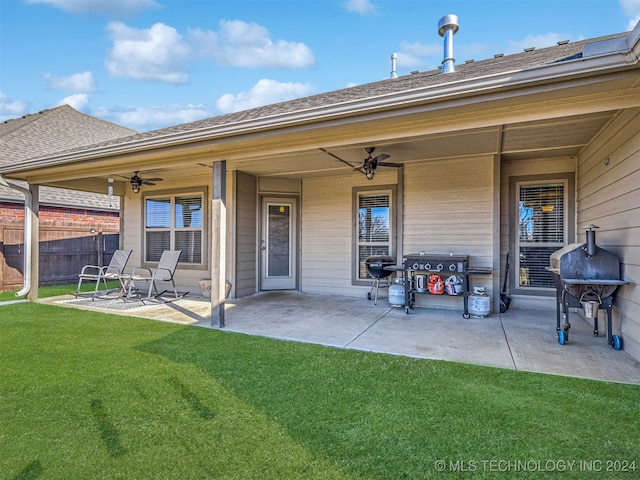 exterior space featuring area for grilling and ceiling fan