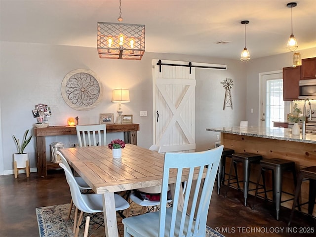 dining area with a barn door