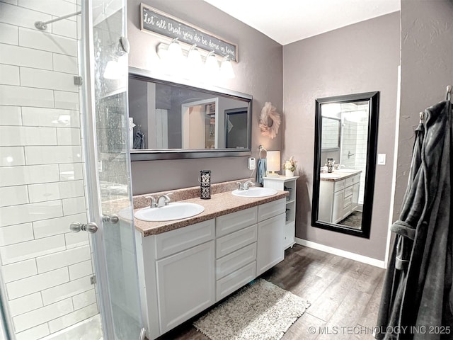 bathroom with wood-type flooring and vanity