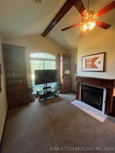 unfurnished living room featuring vaulted ceiling with beams, ceiling fan, and carpet