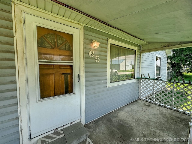 doorway to property with a porch