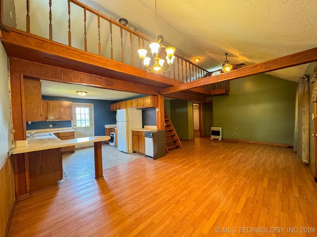 kitchen with light hardwood / wood-style flooring, white fridge, hanging light fixtures, and ceiling fan with notable chandelier