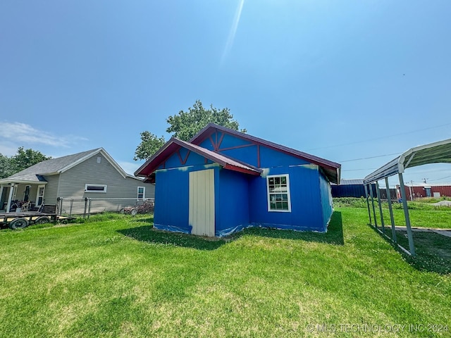 rear view of house with a lawn