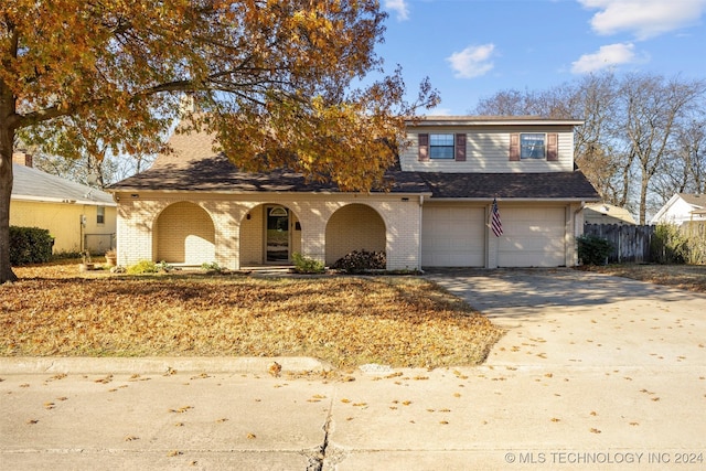 front facade with a garage