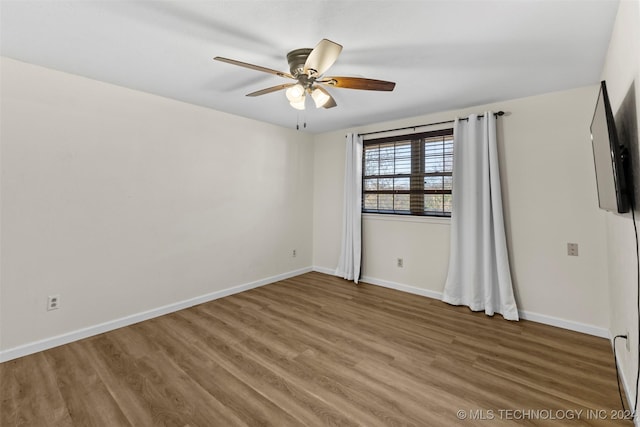 spare room featuring ceiling fan and wood-type flooring