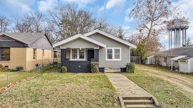 bungalow-style house with a front yard