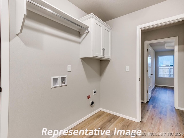 laundry room with washer hookup, hookup for an electric dryer, cabinets, and light wood-type flooring