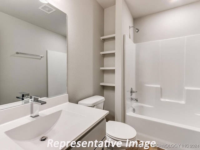 full bathroom featuring vanity, shower / bathing tub combination, and toilet