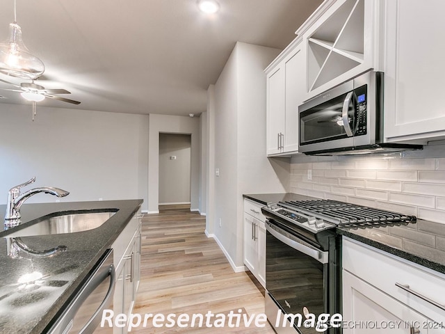 kitchen with white cabinetry, sink, and appliances with stainless steel finishes