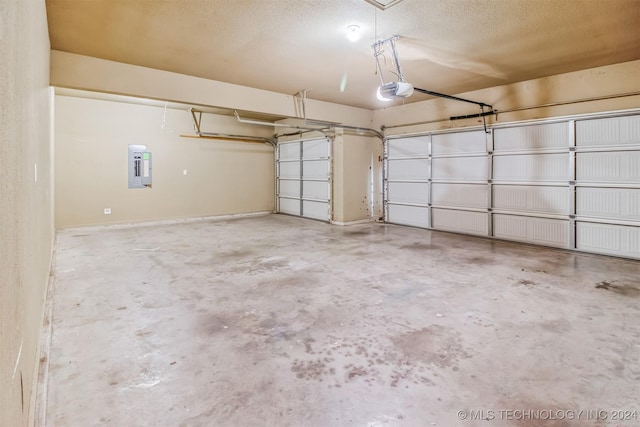 garage with electric panel and a garage door opener