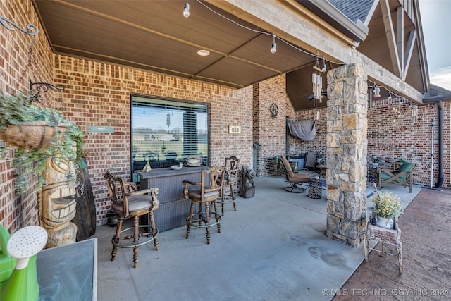 view of patio / terrace featuring a bar