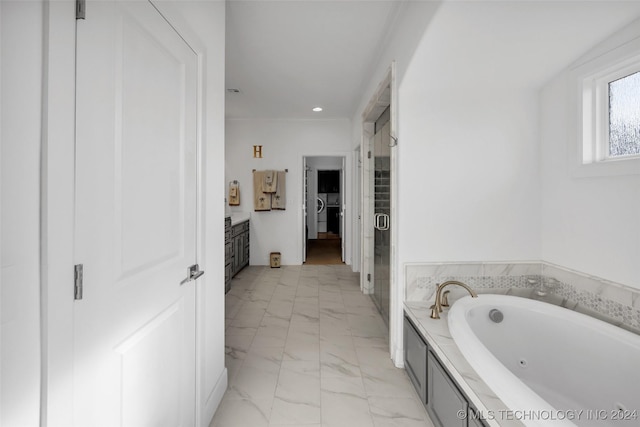 bathroom featuring vanity, ornamental molding, and plus walk in shower