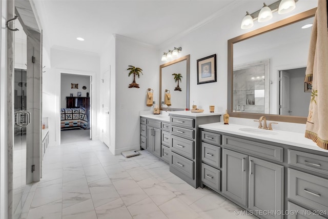 bathroom with vanity, a shower with shower door, and ornamental molding