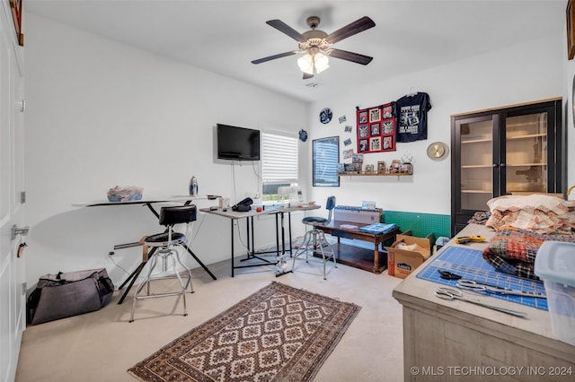 interior space with ceiling fan