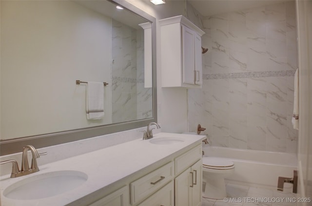 full bathroom with tiled shower / bath, vanity, and toilet