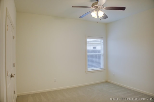 empty room featuring light carpet and ceiling fan