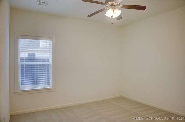 empty room featuring light carpet and ceiling fan