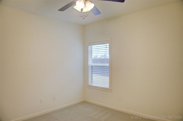 unfurnished room featuring light carpet and ceiling fan