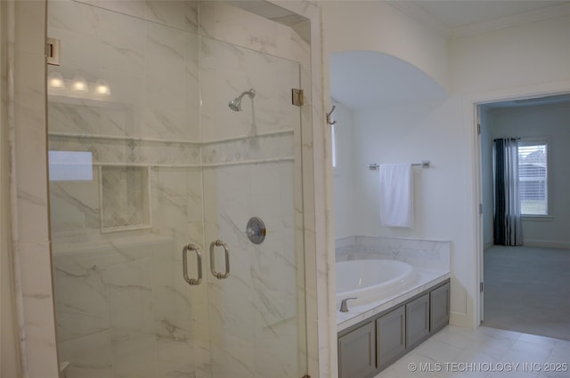 bathroom with independent shower and bath and crown molding