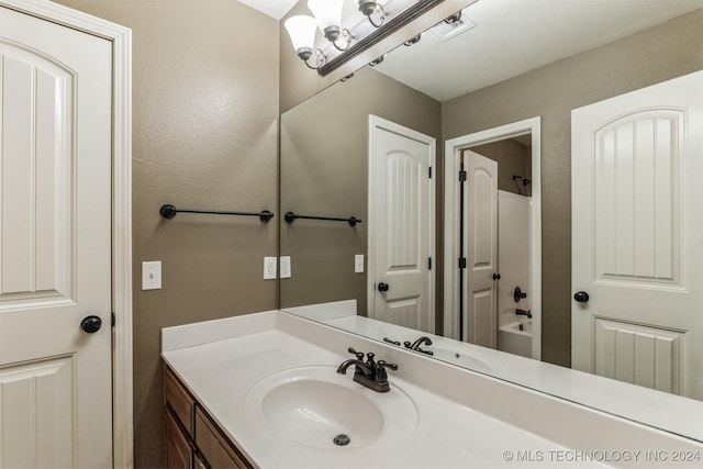 bathroom featuring shower / bathing tub combination and vanity