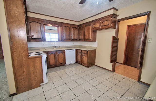 kitchen with ceiling fan, sink, a textured ceiling, white appliances, and light tile patterned floors