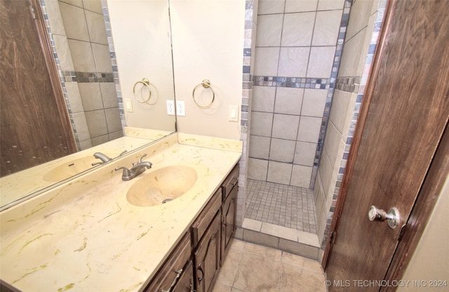 bathroom with tile patterned flooring and vanity