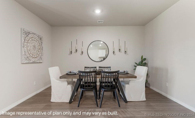 dining space featuring dark wood-type flooring