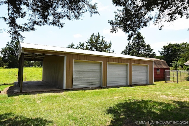 garage featuring a yard