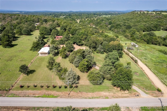 birds eye view of property featuring a rural view