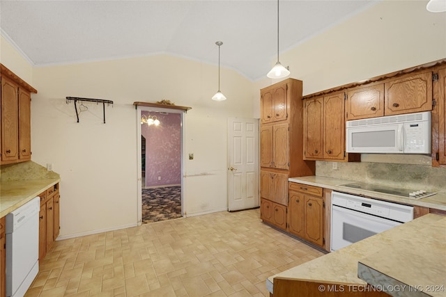 kitchen with white appliances, backsplash, crown molding, vaulted ceiling, and decorative light fixtures