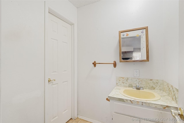 bathroom featuring vanity and a textured ceiling