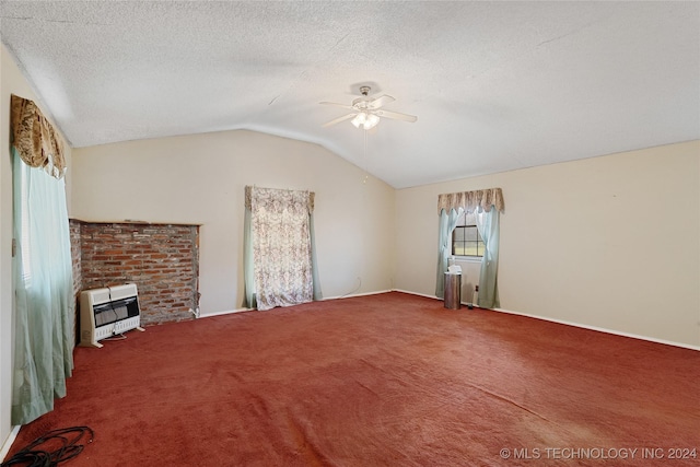 unfurnished living room featuring ceiling fan, heating unit, a textured ceiling, vaulted ceiling, and carpet