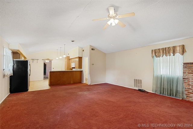 unfurnished living room featuring a textured ceiling, ceiling fan, lofted ceiling, and light carpet