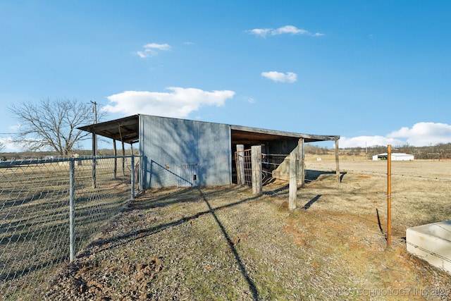 view of outdoor structure with a rural view