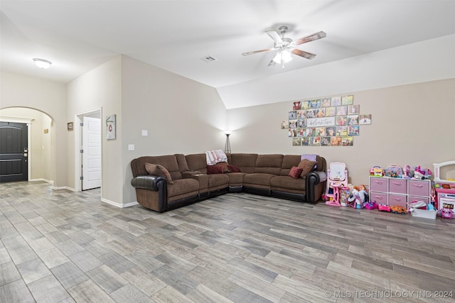 living room with ceiling fan and light hardwood / wood-style floors