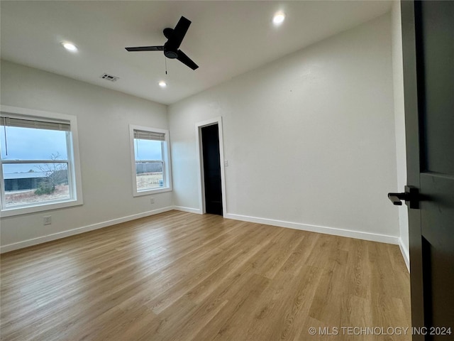 unfurnished bedroom featuring ceiling fan and light wood-type flooring