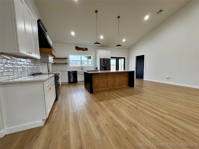 kitchen with a center island, white cabinets, pendant lighting, decorative backsplash, and black appliances