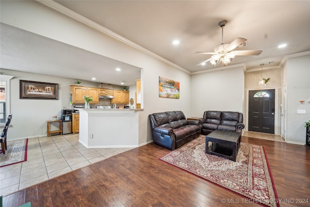 living room with ceiling fan, light wood-type flooring, and crown molding