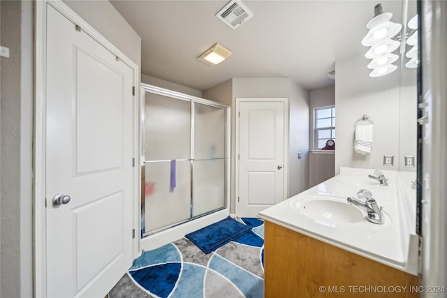 bathroom featuring vanity and walk in shower