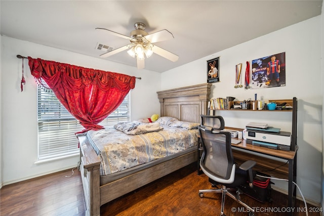 bedroom with ceiling fan and dark hardwood / wood-style flooring